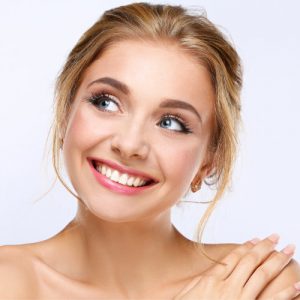 'woman smiling after getting veneers'